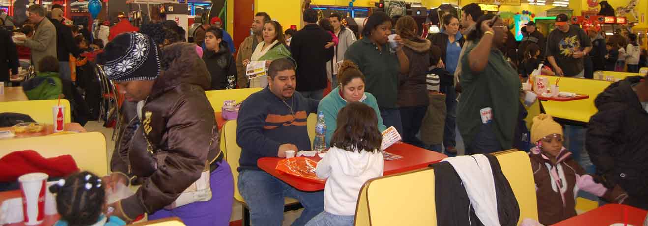 People sitting at dining tables at The People's Choice