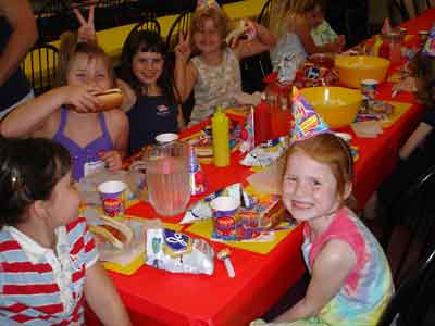 kids eating at long table